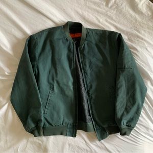green worn and used bomber work jacket